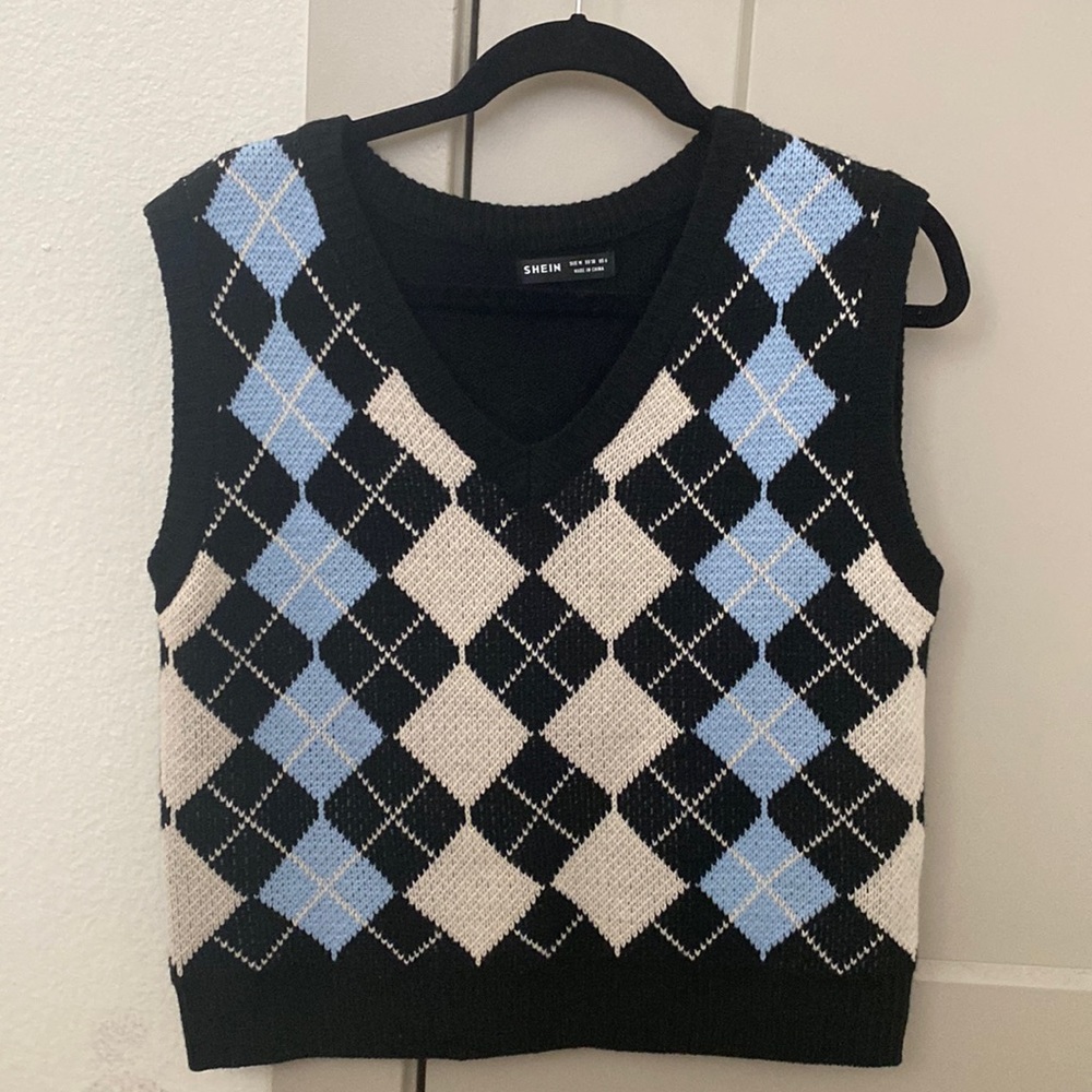 Blue, cream, and black argyle sweater vest.